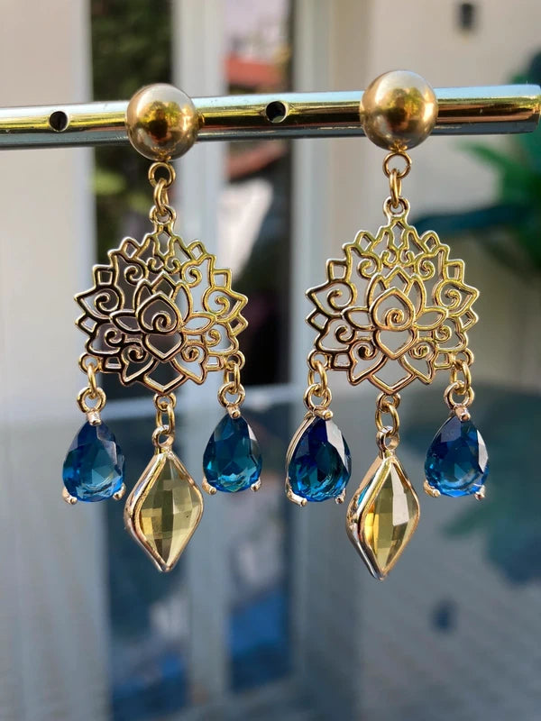 Bloucles d oreilles lotus acier inoxydable et perles de verre excellent état